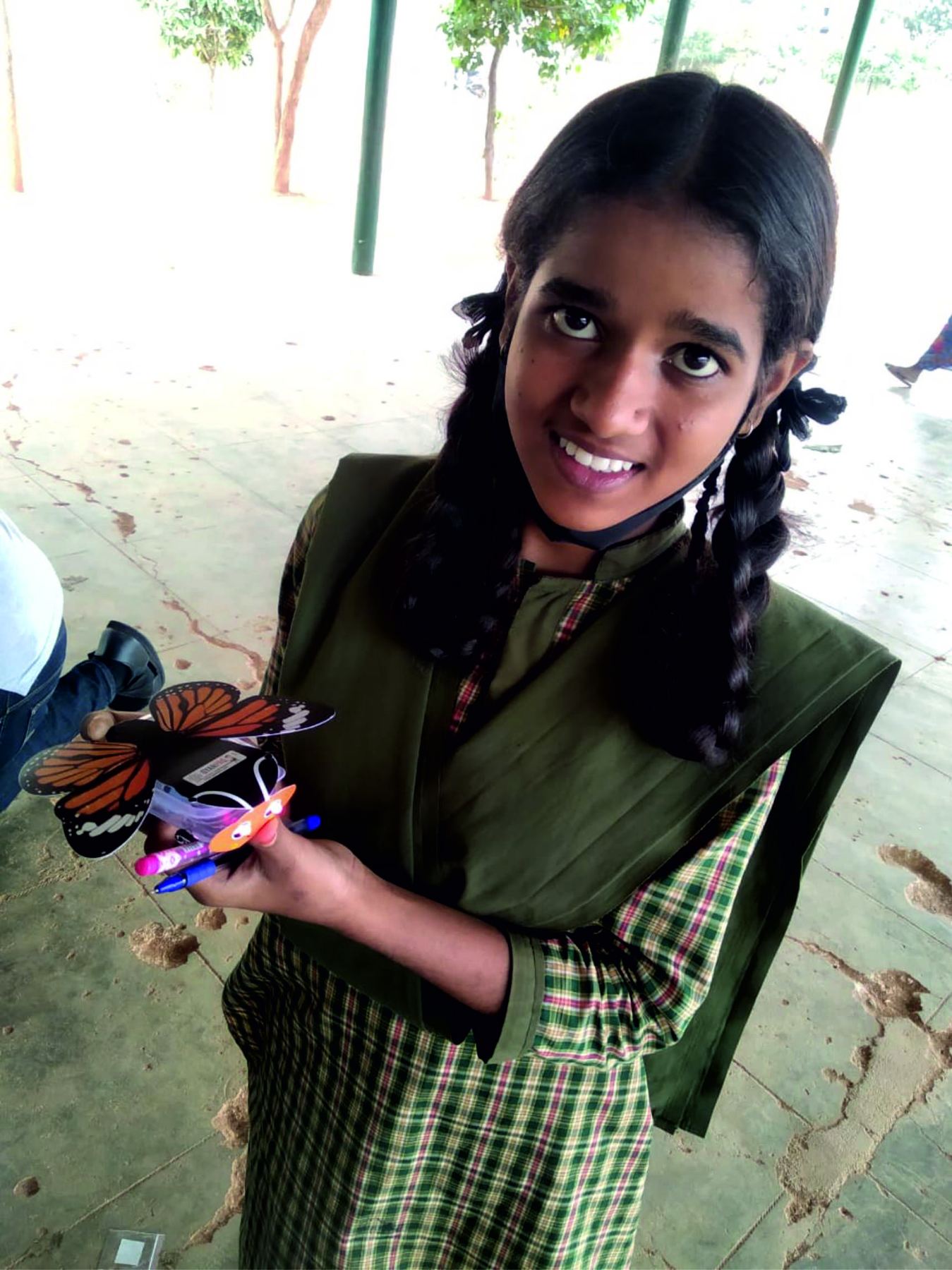 A student presenting a colourful hands-on science model