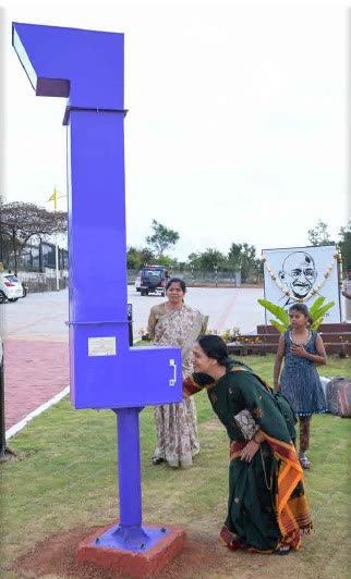 A learner interacting with an outdoor science exhibit