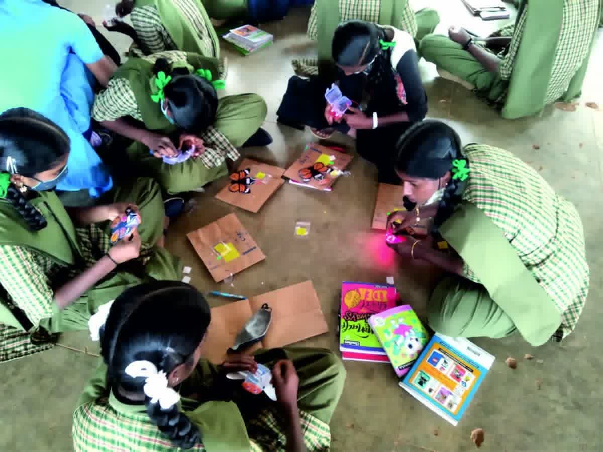 Students building activity models during a STEM workshop